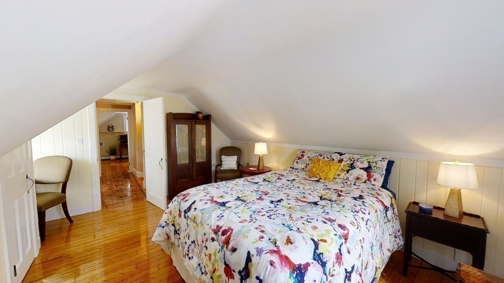 192 Berwick Road Attleboro, MA 02703 - Photo 29 of 42 a bedroom with a bed and dresser with mirror