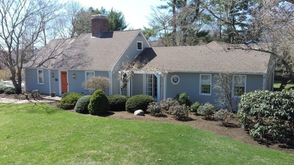 192 Berwick Road Attleboro, MA 02703 - Photo 34 of 42 a front view of a house with a garden and plants