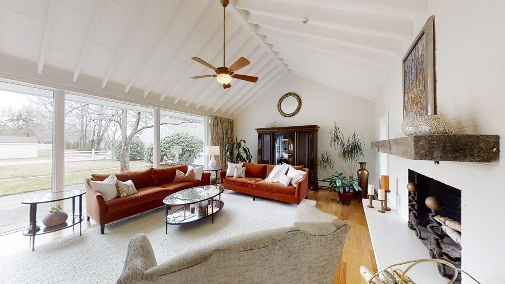 192 Berwick Road Attleboro, MA 02703 - Photo 6 of 42 a living room with furniture a fireplace and a large window