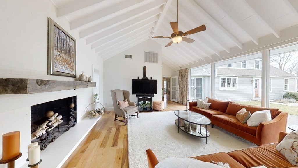 192 Berwick Road Attleboro, MA 02703 - Photo 9 of 42 a living room with furniture a fireplace and a flat screen tv