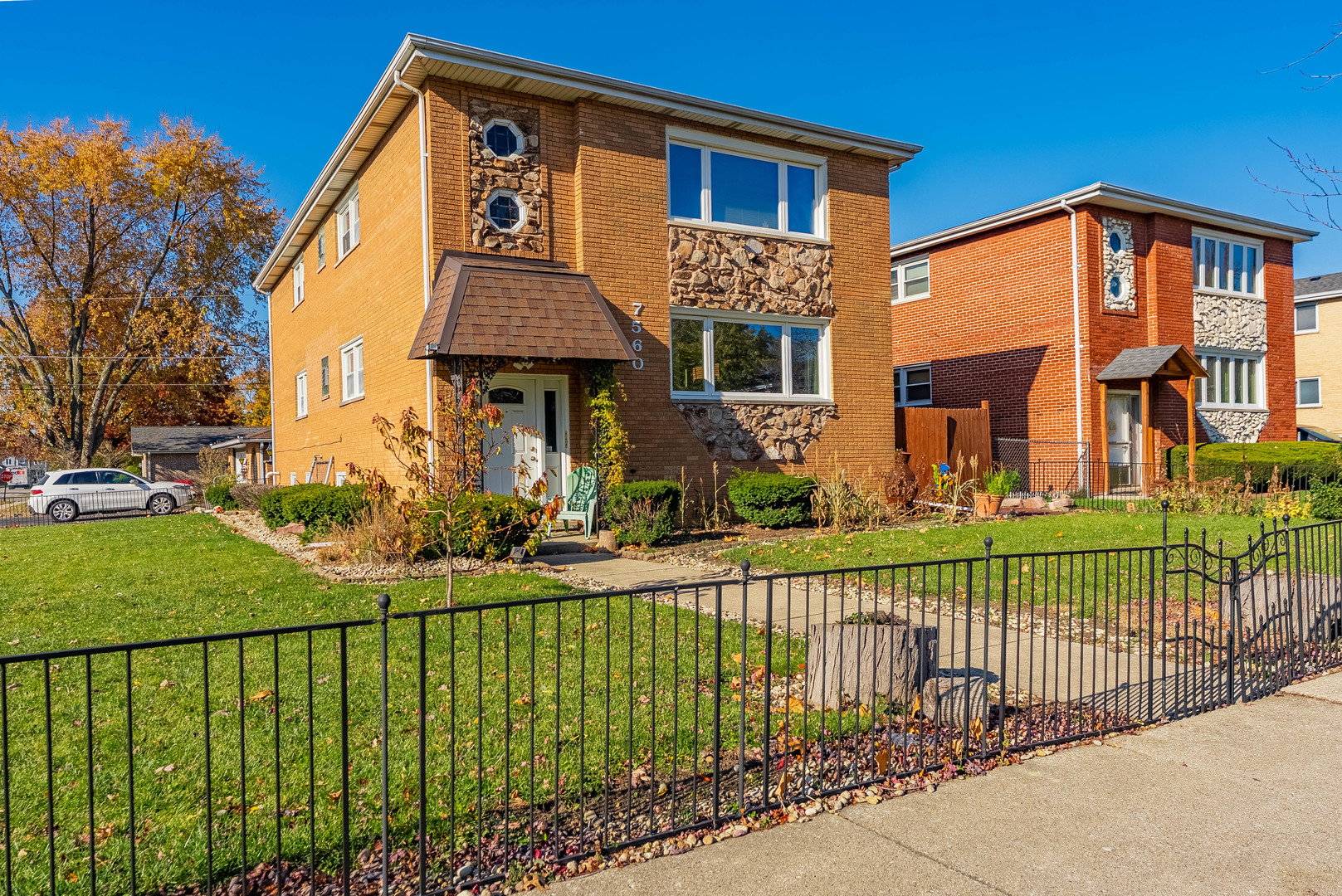 7560 Banks Street, Unit 2 Justice, IL 60458 - Photo 1 of 14 a front view of a house with a yard