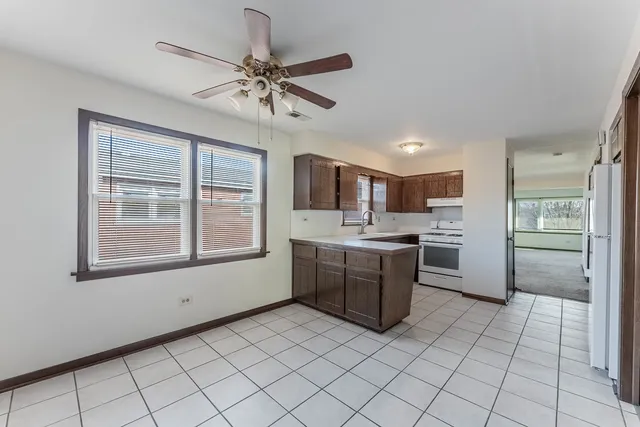 a kitchen with a refrigerator a sink and dishwasher