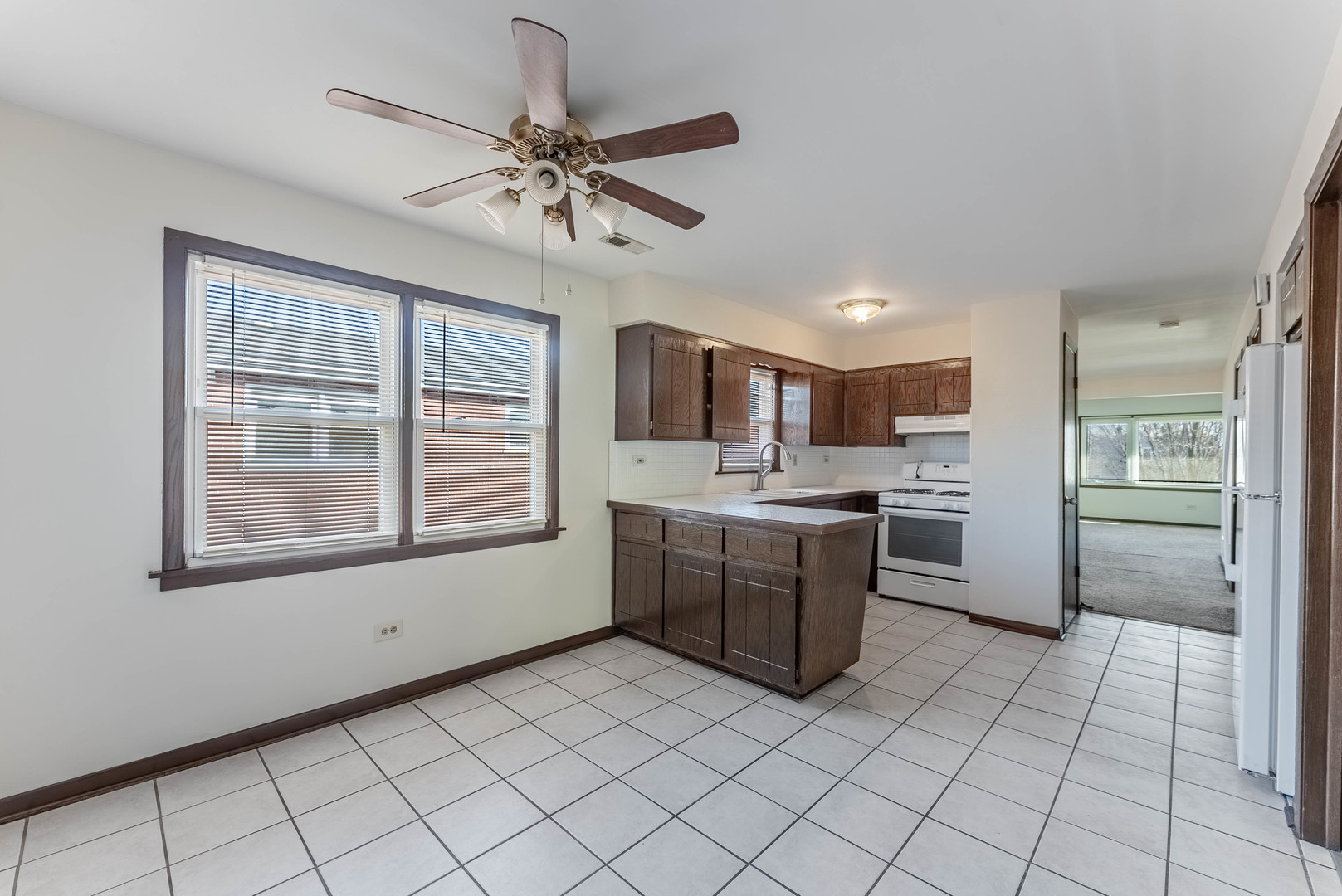 7560 Banks Street, Unit 2 Justice, IL 60458 - Photo 11 of 14 a kitchen with a refrigerator a sink and dishwasher