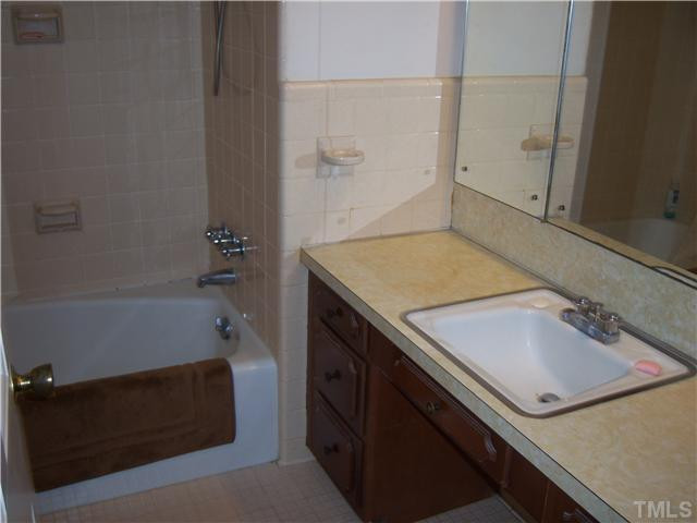 1601 Rosedale Avenue Durham, NC 27707 - Photo 12 of 13 Hall bath features ceramic tile, tub and shower, pretty much as it was when originally built. Bathroom