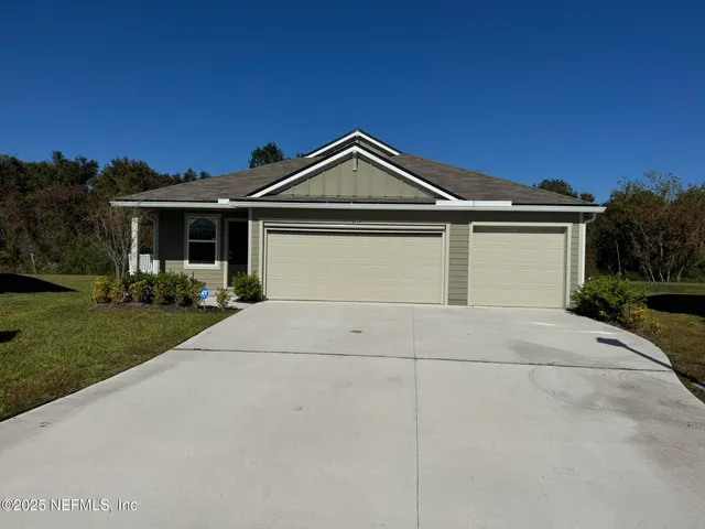a front view of a house with yard