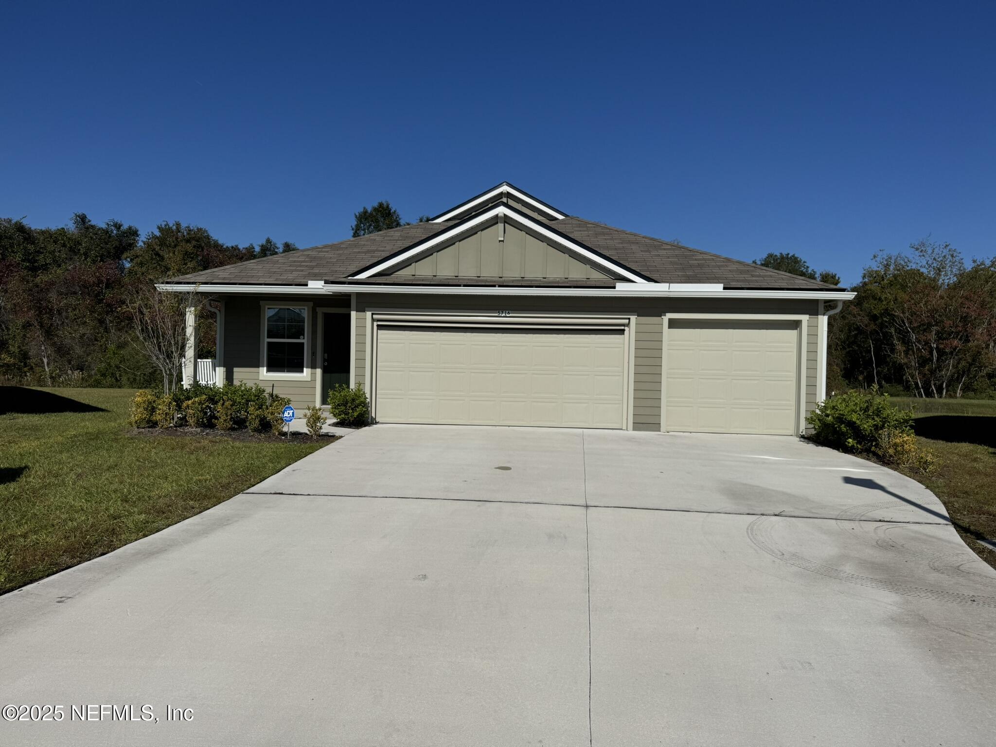 a front view of a house with yard