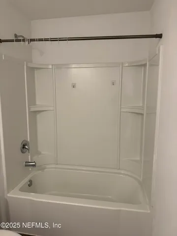 a view of a room with an empty space