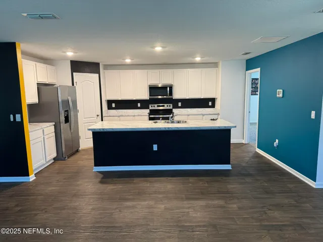 a view of a lake with a big yard