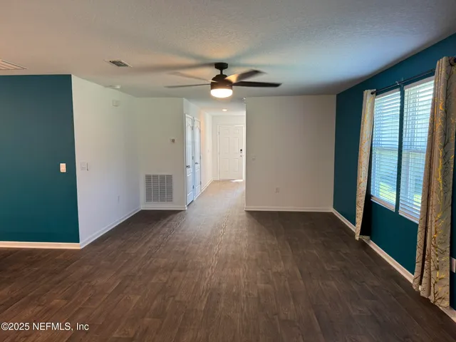 an empty room with windows