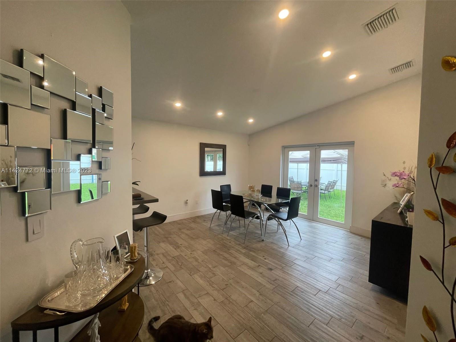 Silver Falls Miramar, FL 33027 - Photo 11 of 24 a dining room with furniture and a flat screen tv