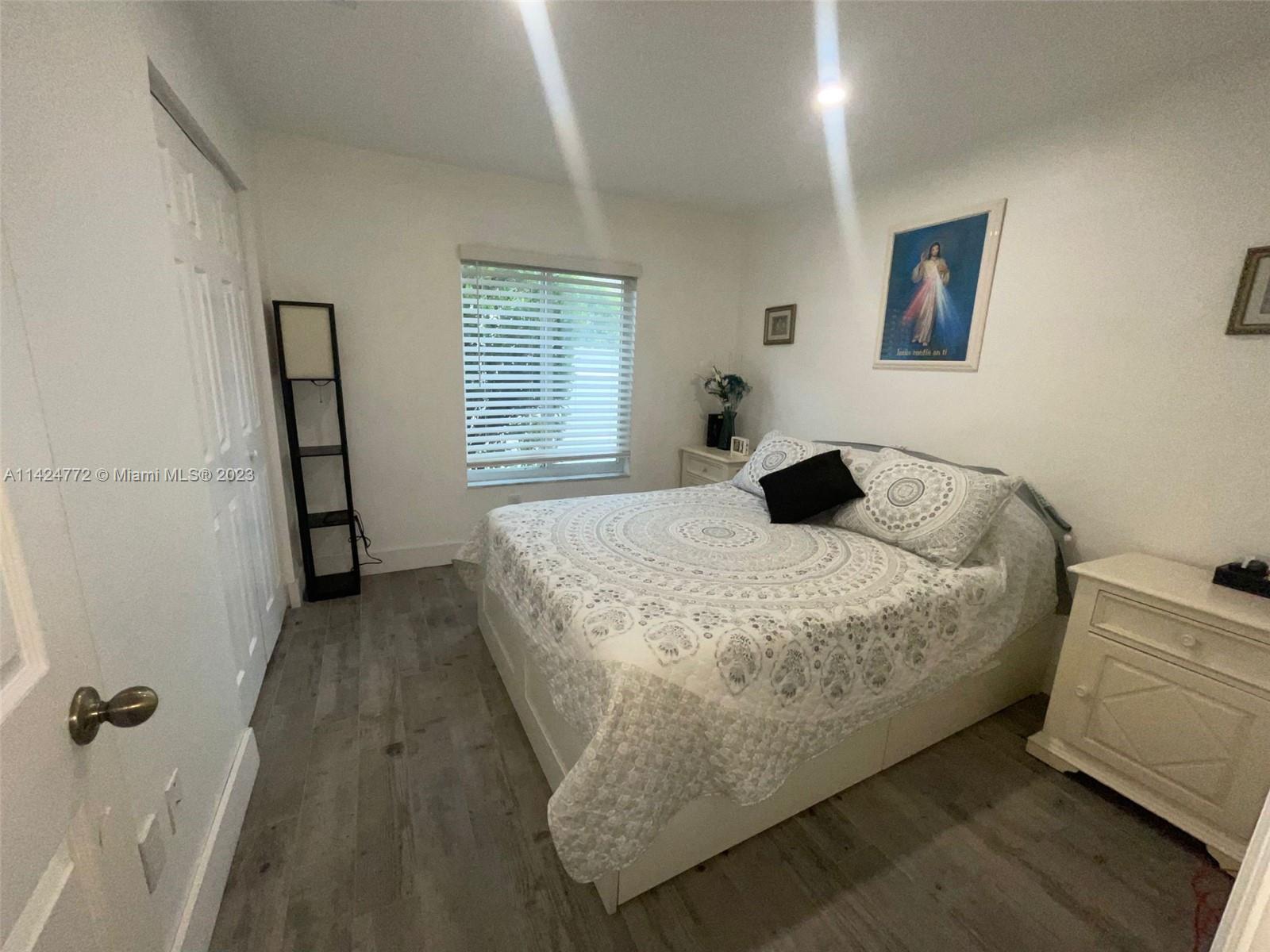 Silver Falls Miramar, FL 33027 - Photo 13 of 24 a bedroom with a bed and a window