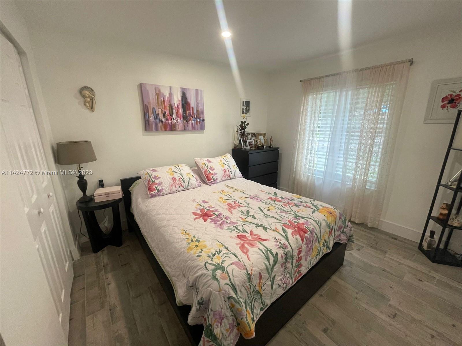 Silver Falls Miramar, FL 33027 - Photo 15 of 24 a bedroom with a bed and a window