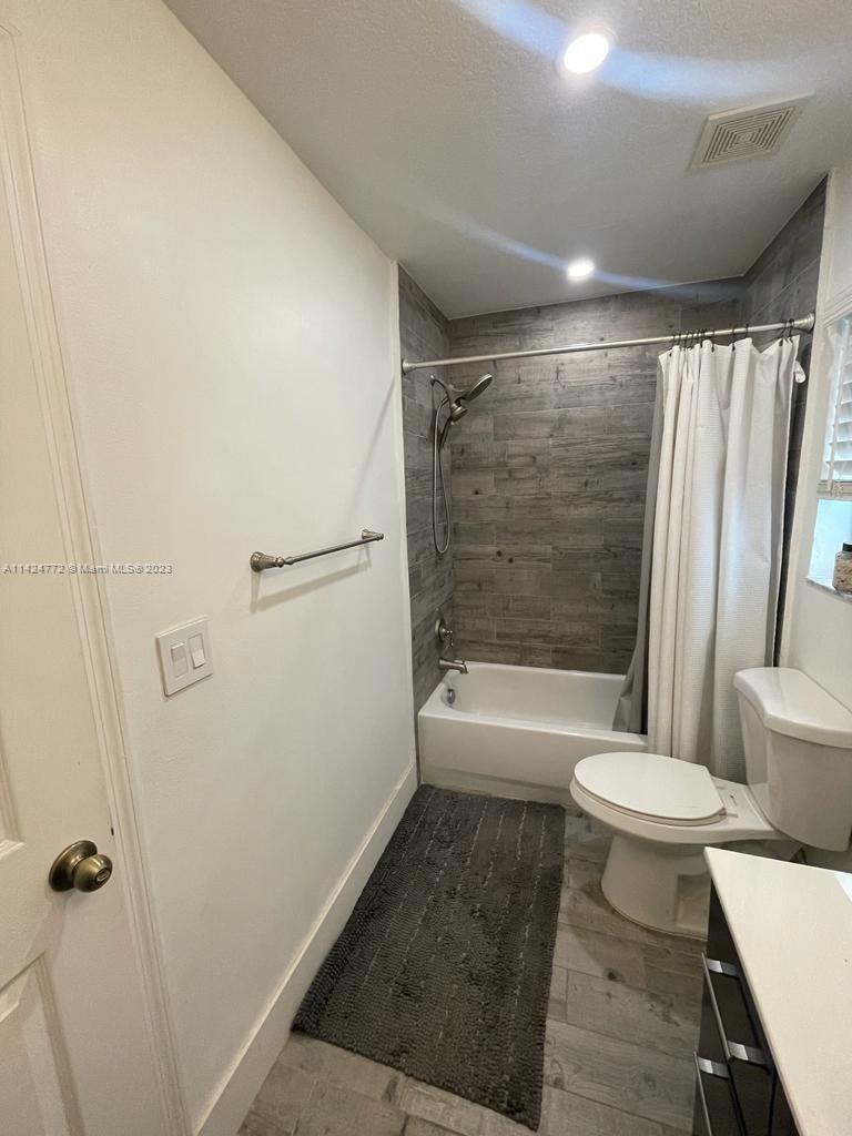 Silver Falls Miramar, FL 33027 - Photo 16 of 24 a bathroom with a bathtub and a toilet