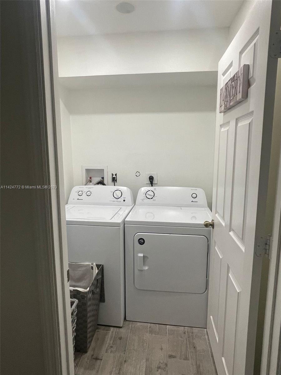 Silver Falls Miramar, FL 33027 - Photo 19 of 24 a utility room with dryer and washer