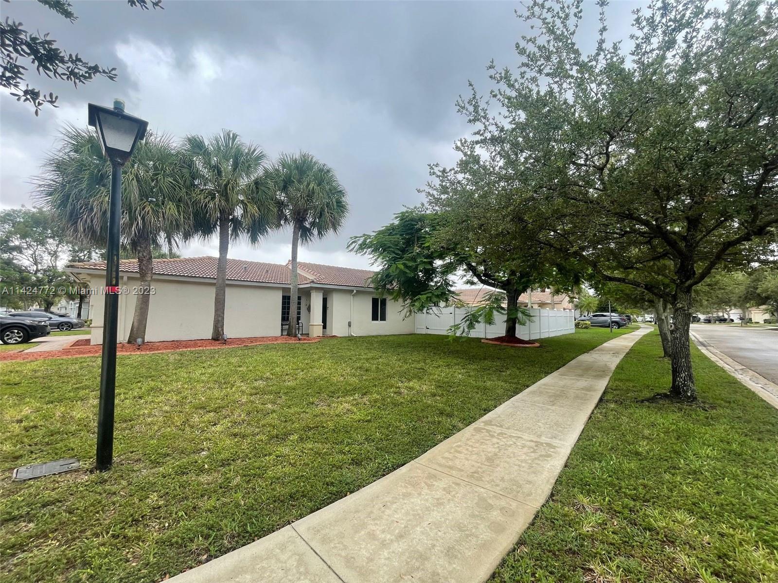 Silver Falls Miramar, FL 33027 - Photo 21 of 24 a view of a house with a yard