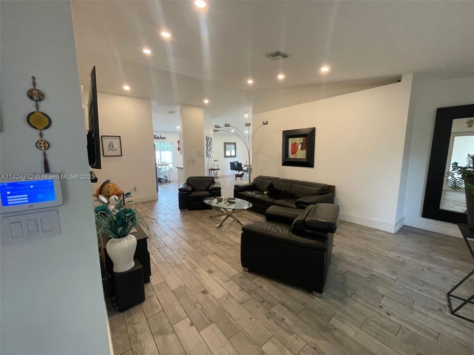 Silver Falls Miramar, FL 33027 - Photo 4 of 24 a living room with furniture and a potted plant