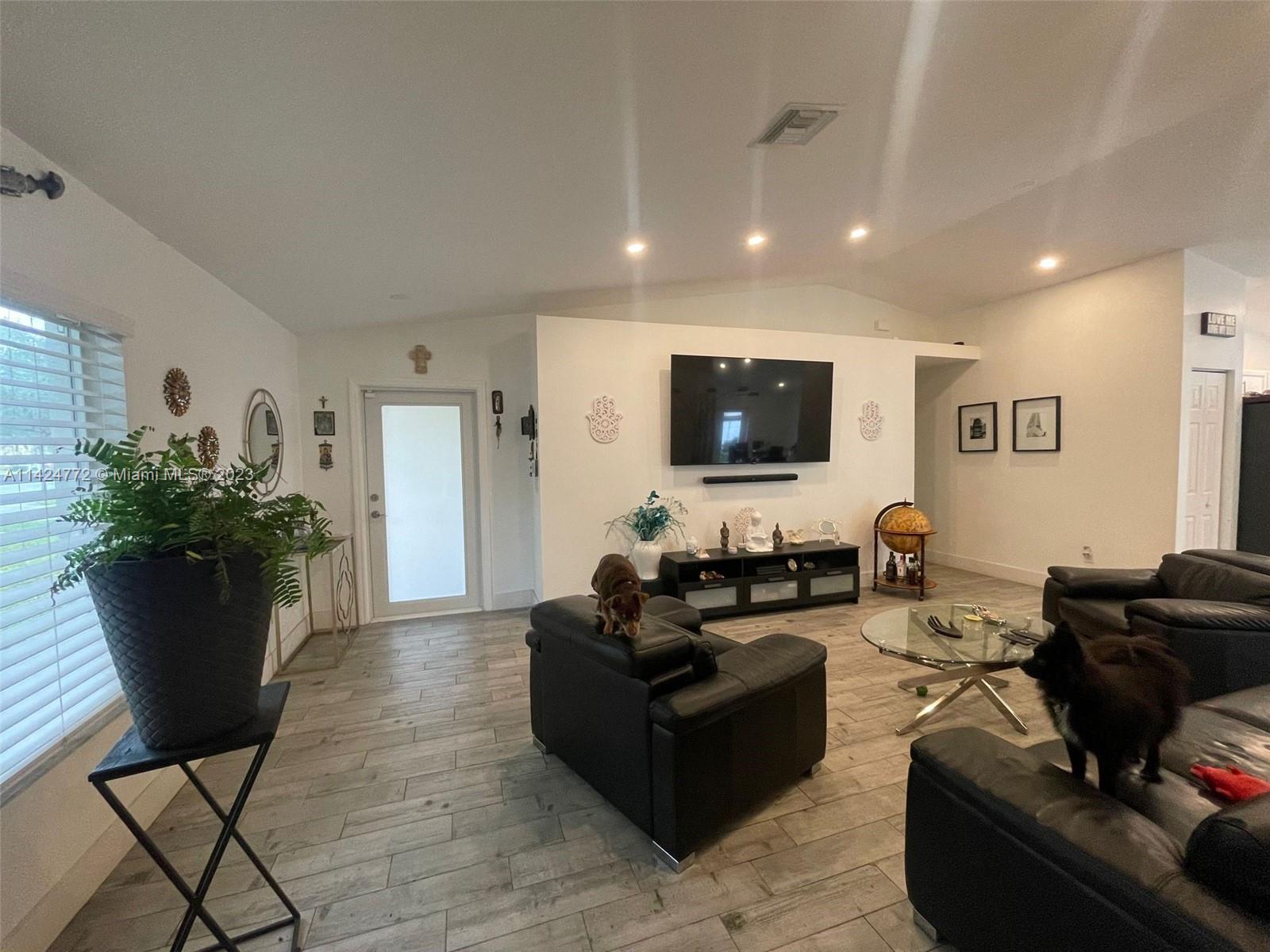Silver Falls Miramar, FL 33027 - Photo 5 of 24 a living room with furniture and a flat screen tv