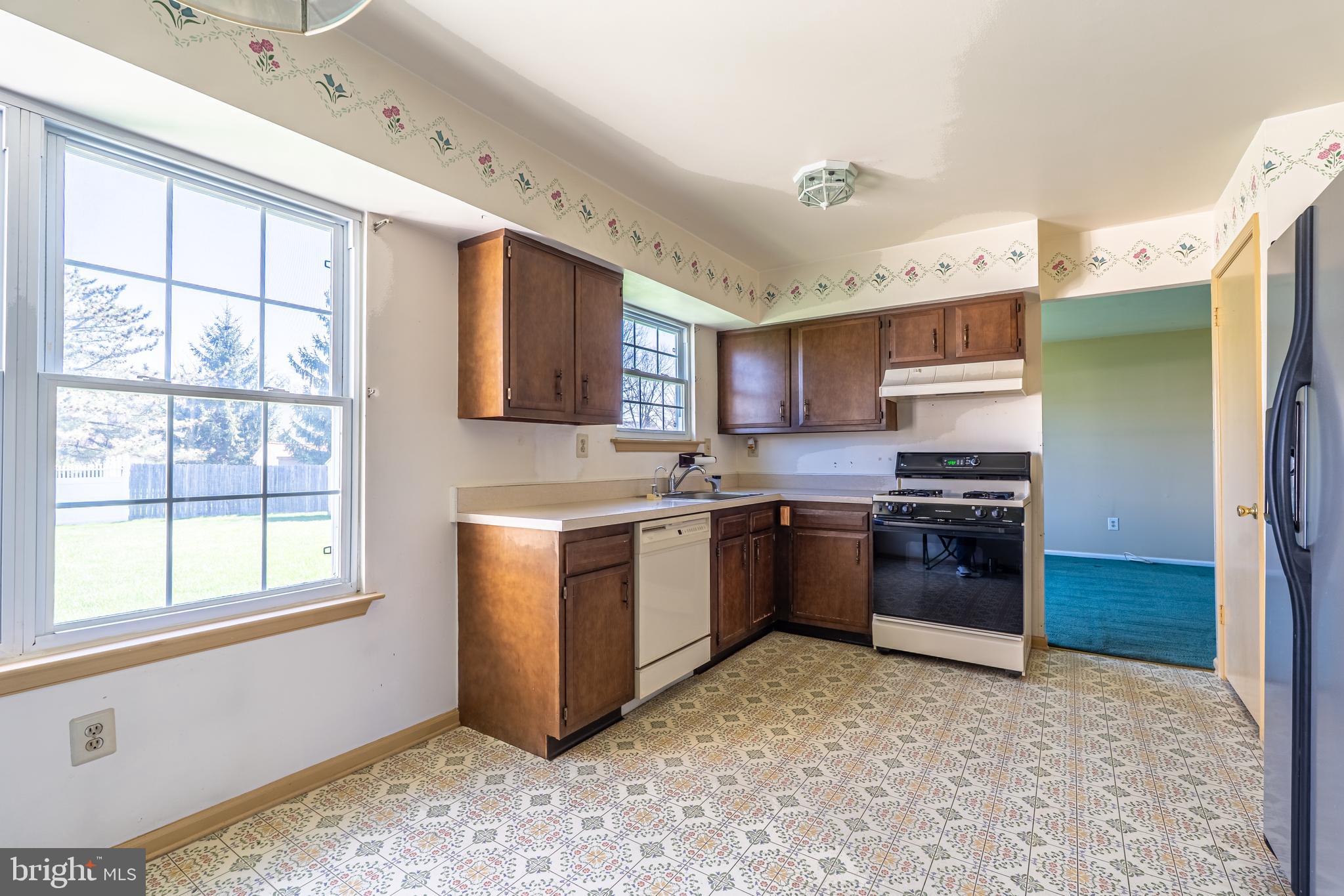 894 Herman Road Horsham, PA 19044 - Photo 11 of 32 a kitchen with granite countertop a refrigerator stove top oven and sink