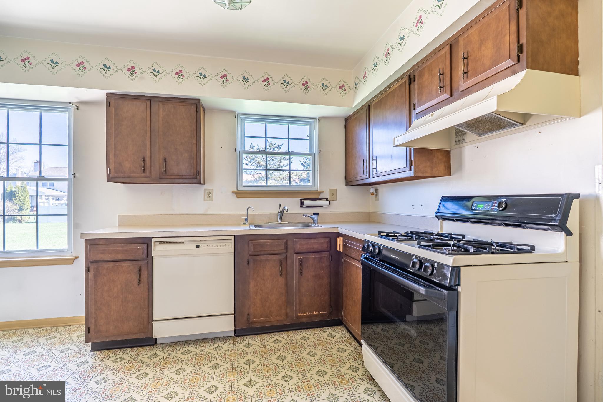 894 Herman Road Horsham, PA 19044 - Photo 15 of 32 a kitchen with a stove sink and cabinets