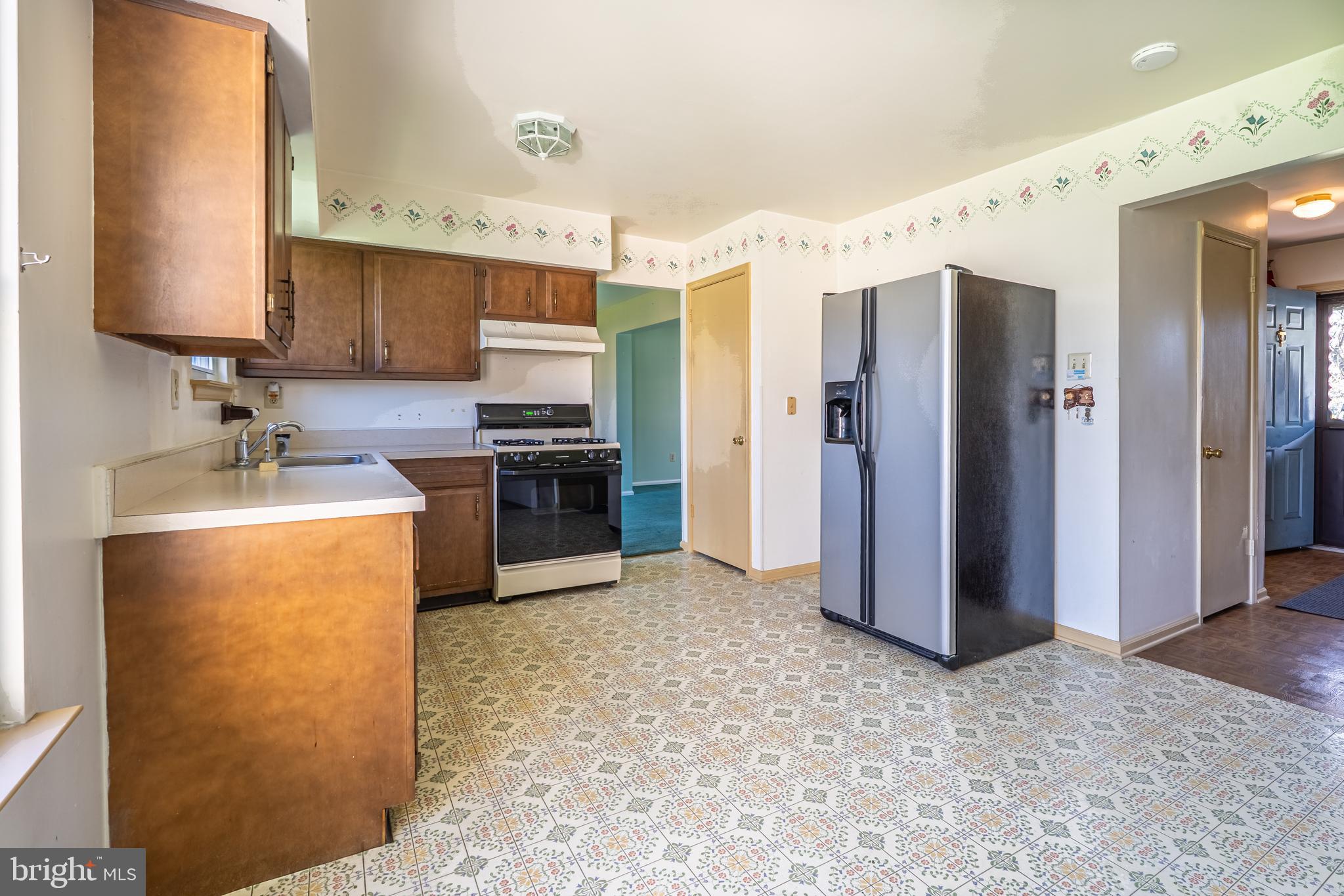 894 Herman Road Horsham, PA 19044 - Photo 16 of 32 a kitchen with stainless steel appliances granite countertop a refrigerator a stove and a sink