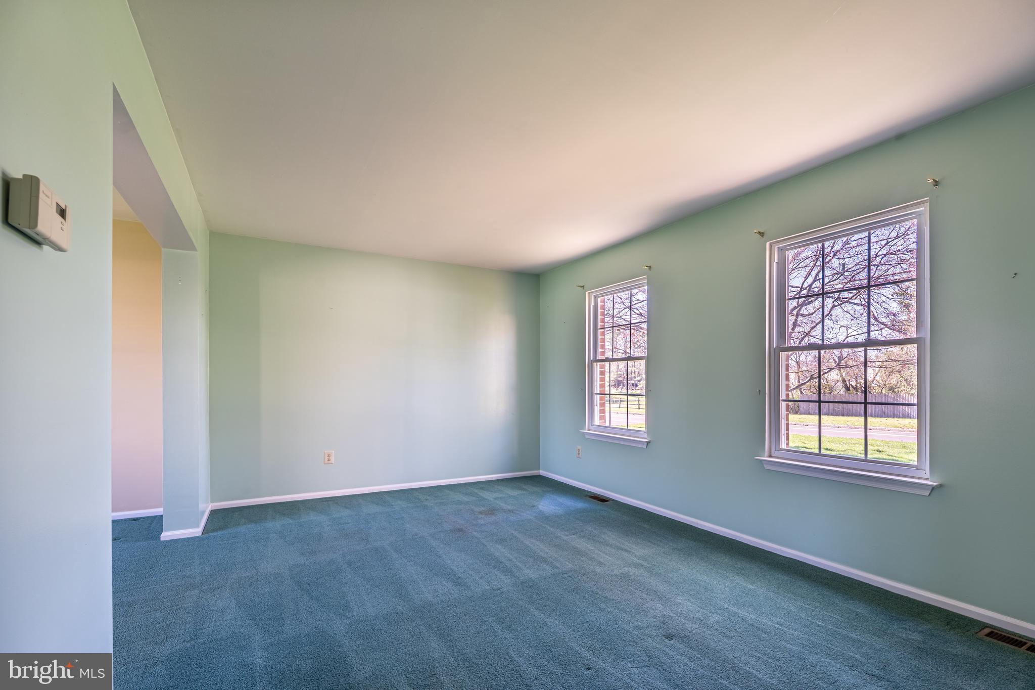 894 Herman Road Horsham, PA 19044 - Photo 4 of 32 a view of an empty room with a window and wooden floor