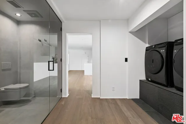 a view of bathroom with a toilet a sink and a mirror