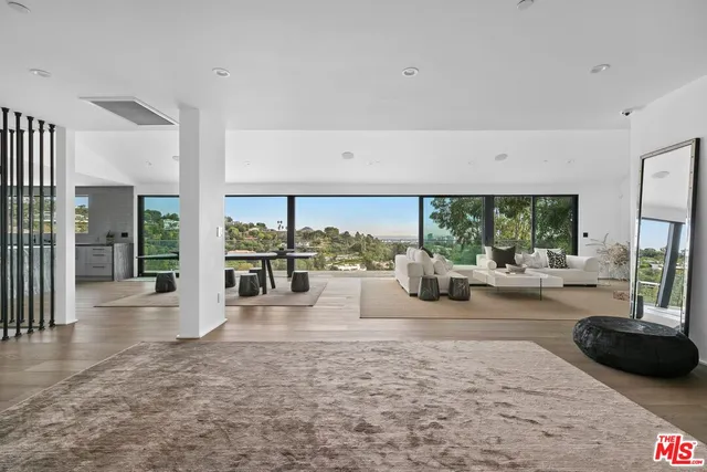 a lobby with furniture and a floor to ceiling window