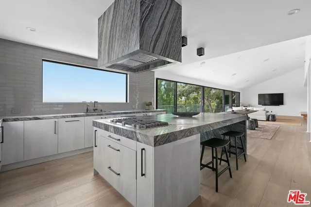 a kitchen with a stove and a table