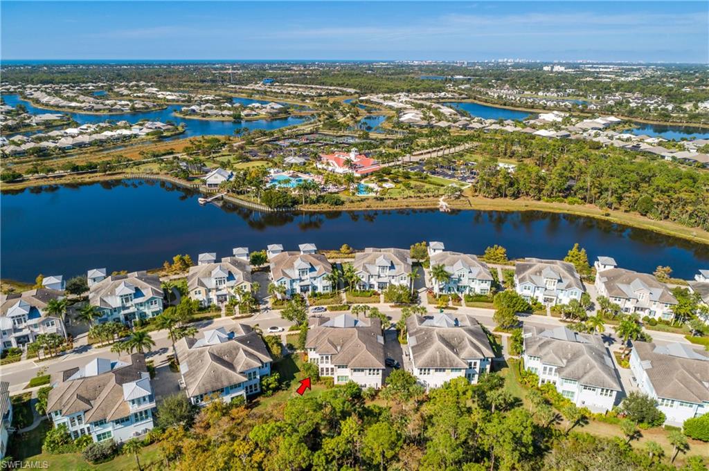 6552 Dominica Drive, Unit 101 Naples, FL 34113 - Photo 44 of 50 an aerial view of ocean and residential houses with outdoor space