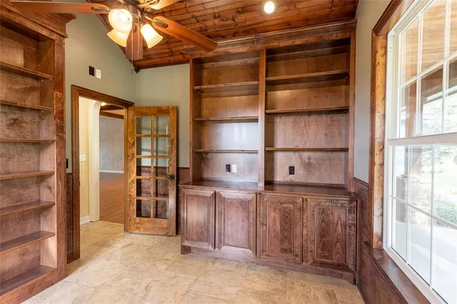 a kitchen with stainless steel appliances a refrigerator and cabinets