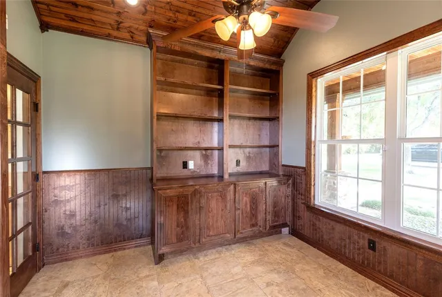 an empty room with closet area