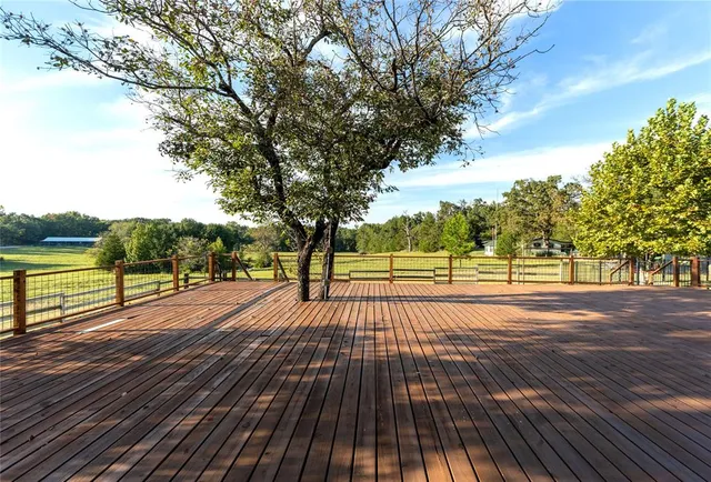 a swimming pool with trees in the background