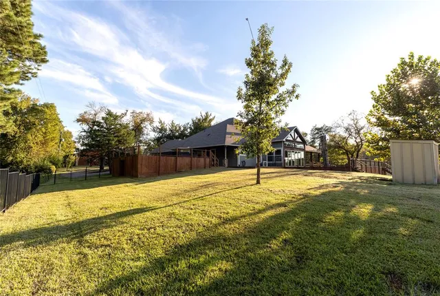a view of a house with a tree