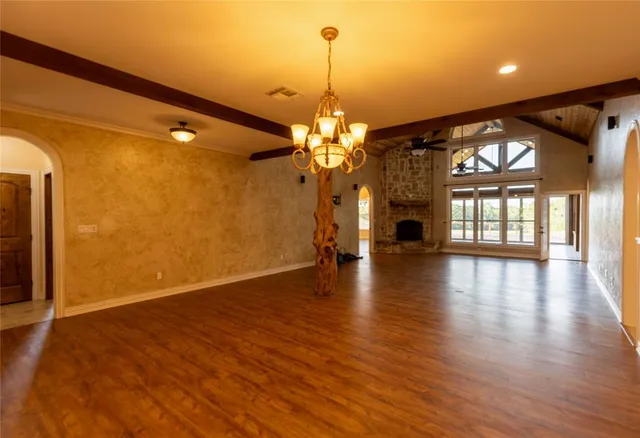a view of a water heater room with a fireplace