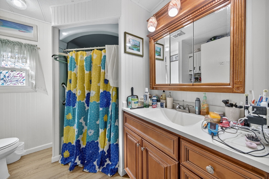 1 Clems Way Acushnet, MA 02743 - Photo 15 of 16 a bathroom with a sink vanity and a mirror