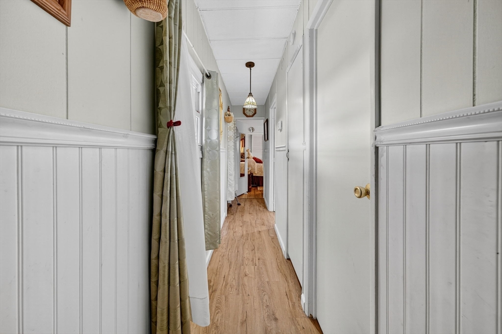 1 Clems Way Acushnet, MA 02743 - Photo 16 of 16 a view of a hallway with wooden floor and staircase