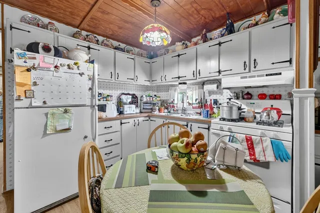 a dining room filled with lots of furniture and appliances