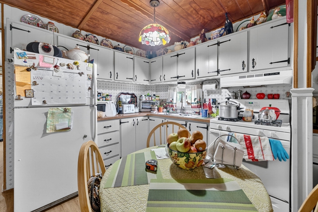 1 Clems Way Acushnet, MA 02743 - Photo 10 of 16 a living room with lots of furniture and clutter