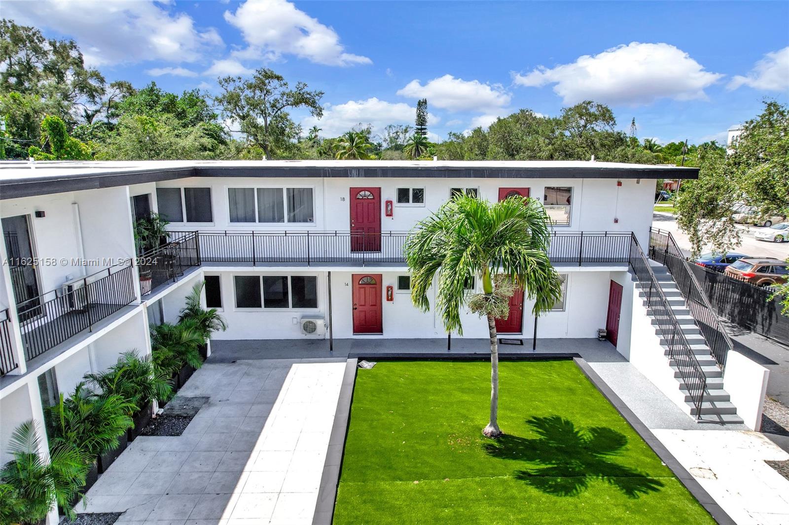 14280 Northeast 6th Avenue North Miami, FL 33161 - Photo 22 of 51 a front view of a house with a yard