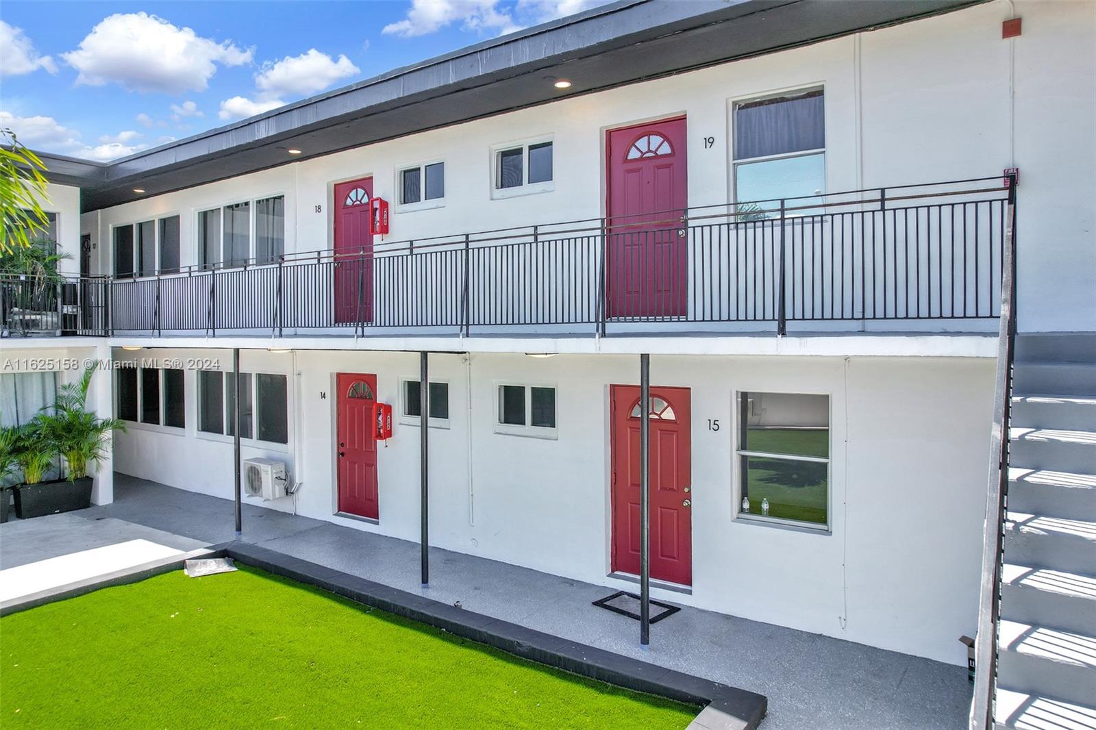 14280 Northeast 6th Avenue North Miami, FL 33161 - Photo 24 of 51 a front view of building with yard