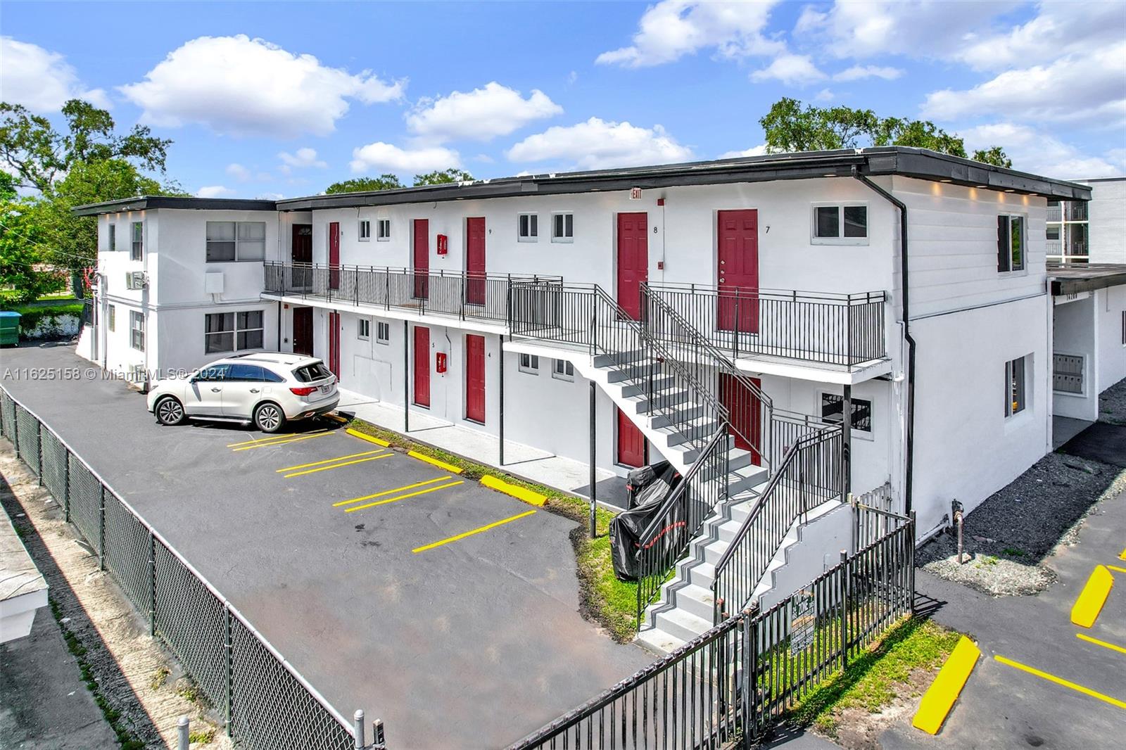 14280 Northeast 6th Avenue North Miami, FL 33161 - Photo 29 of 51 a car parked in front of house with a yard