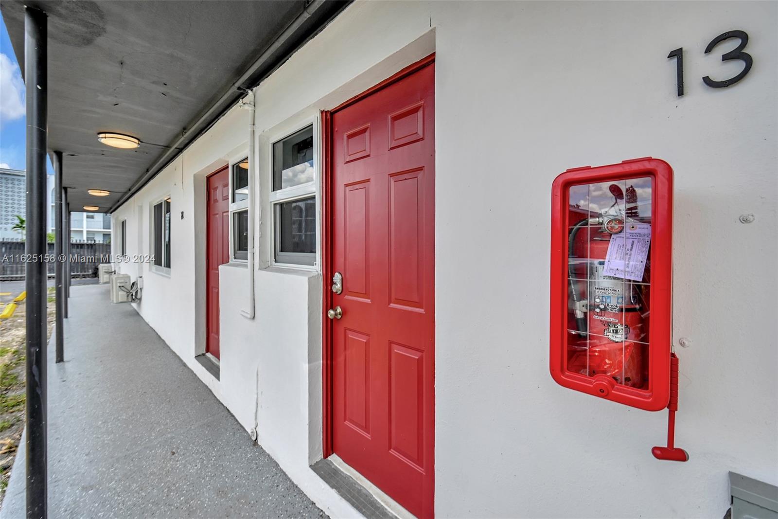 14280 Northeast 6th Avenue North Miami, FL 33161 - Photo 34 of 51 a hallway with painting on the wall