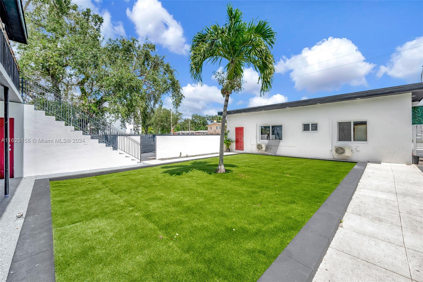 14280 Northeast 6th Avenue North Miami, FL 33161 - Photo 37 of 51 a front view of house with yard