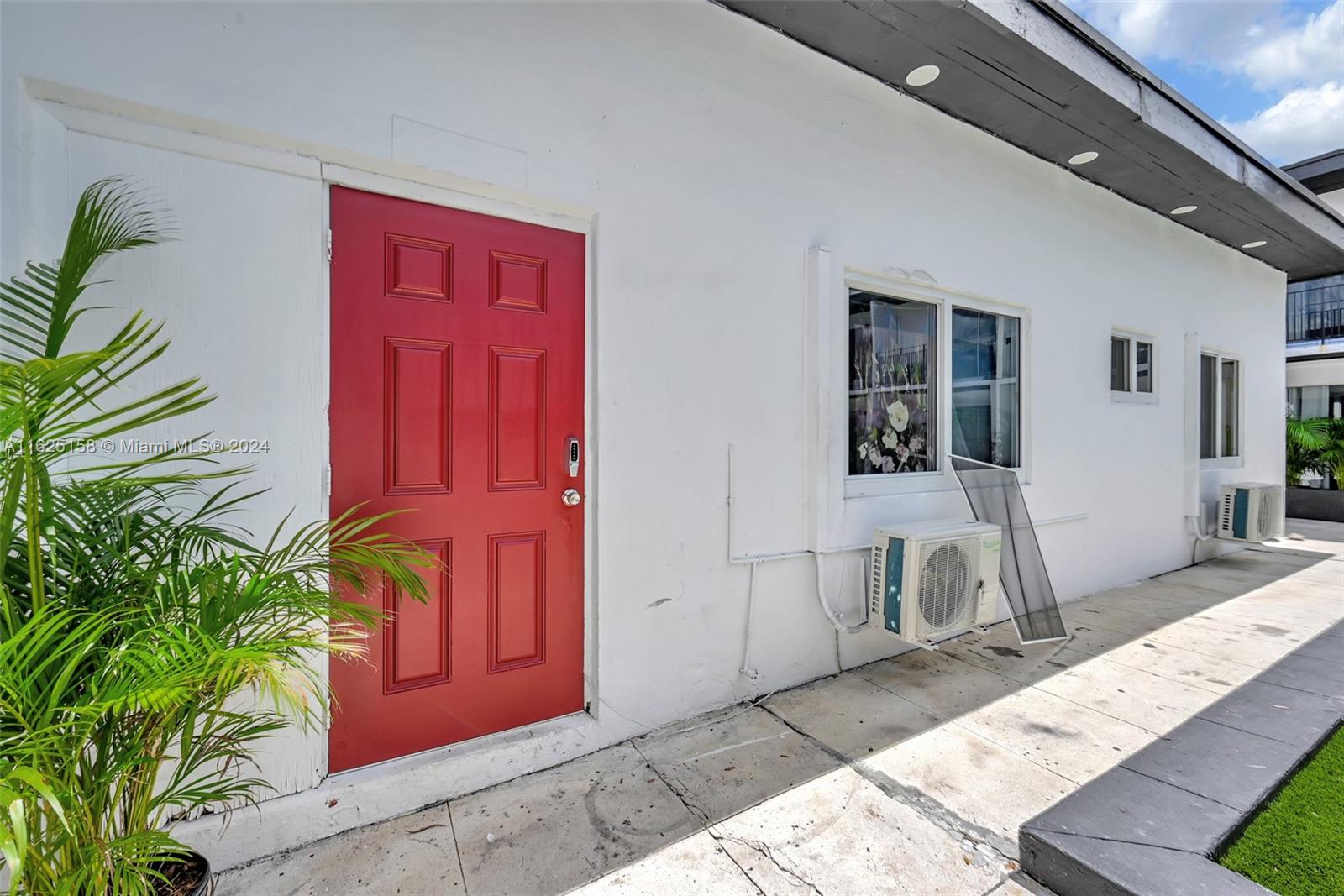 14280 Northeast 6th Avenue North Miami, FL 33161 - Photo 41 of 51 a front view of a house with outdoor seating