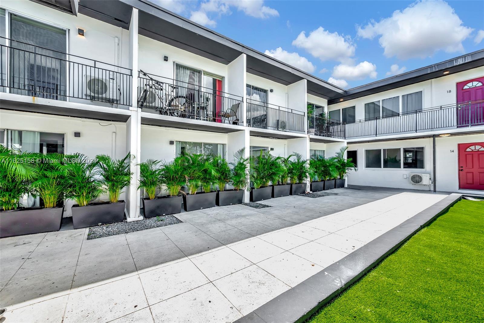 14280 Northeast 6th Avenue North Miami, FL 33161 - Photo 43 of 51 a view of a building with a garden