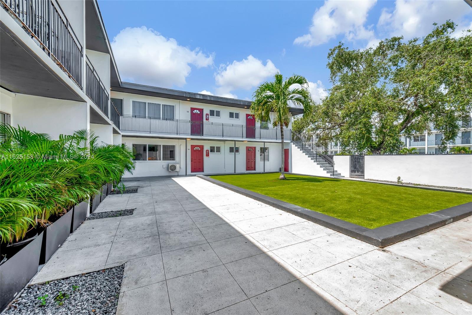 14280 Northeast 6th Avenue North Miami, FL 33161 - Photo 46 of 51 a house with lots of trees in the background