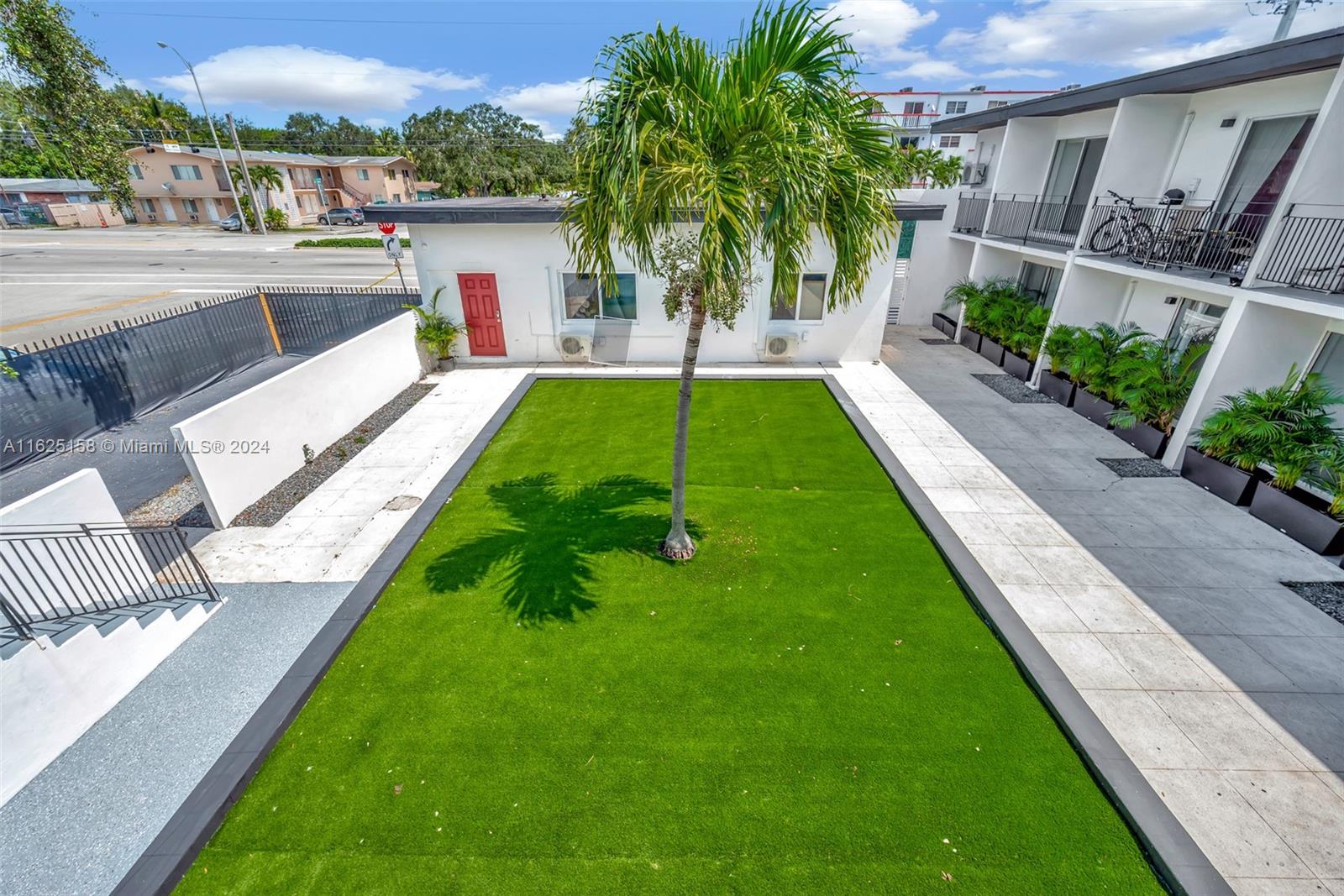 14280 Northeast 6th Avenue North Miami, FL 33161 - Photo 50 of 51 a view of a house with a yard and sitting area