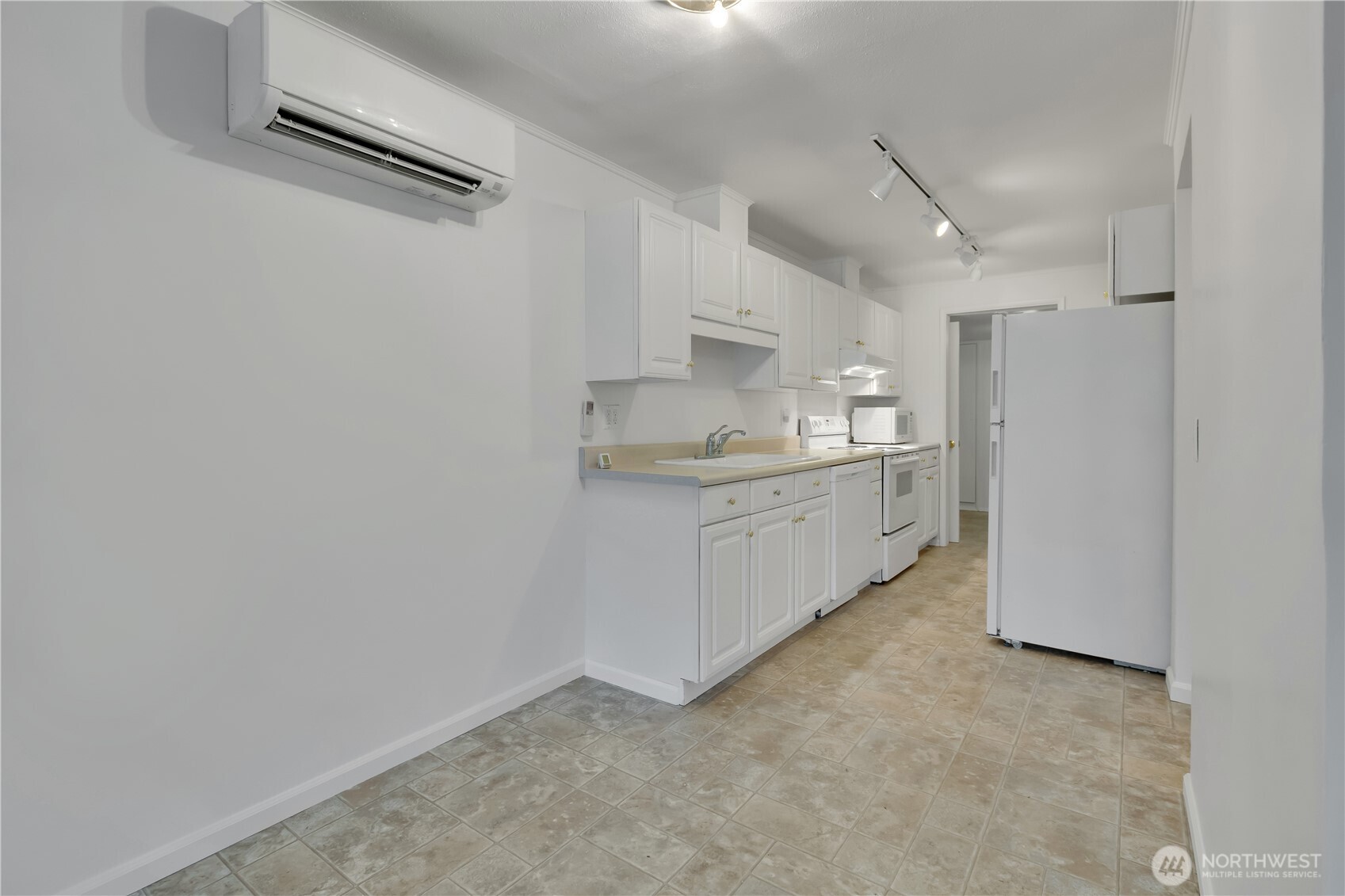 10421 2nd Place Southwest Seattle, WA 98146 - Photo 11 of 28 a kitchen with cabinets and a sink