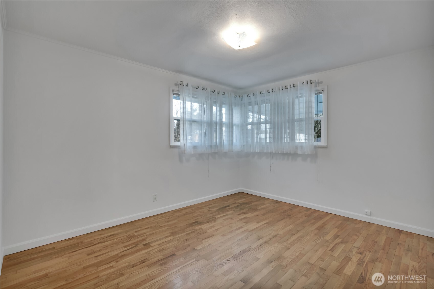 10421 2nd Place Southwest Seattle, WA 98146 - Photo 17 of 28 wooden floor in an empty room