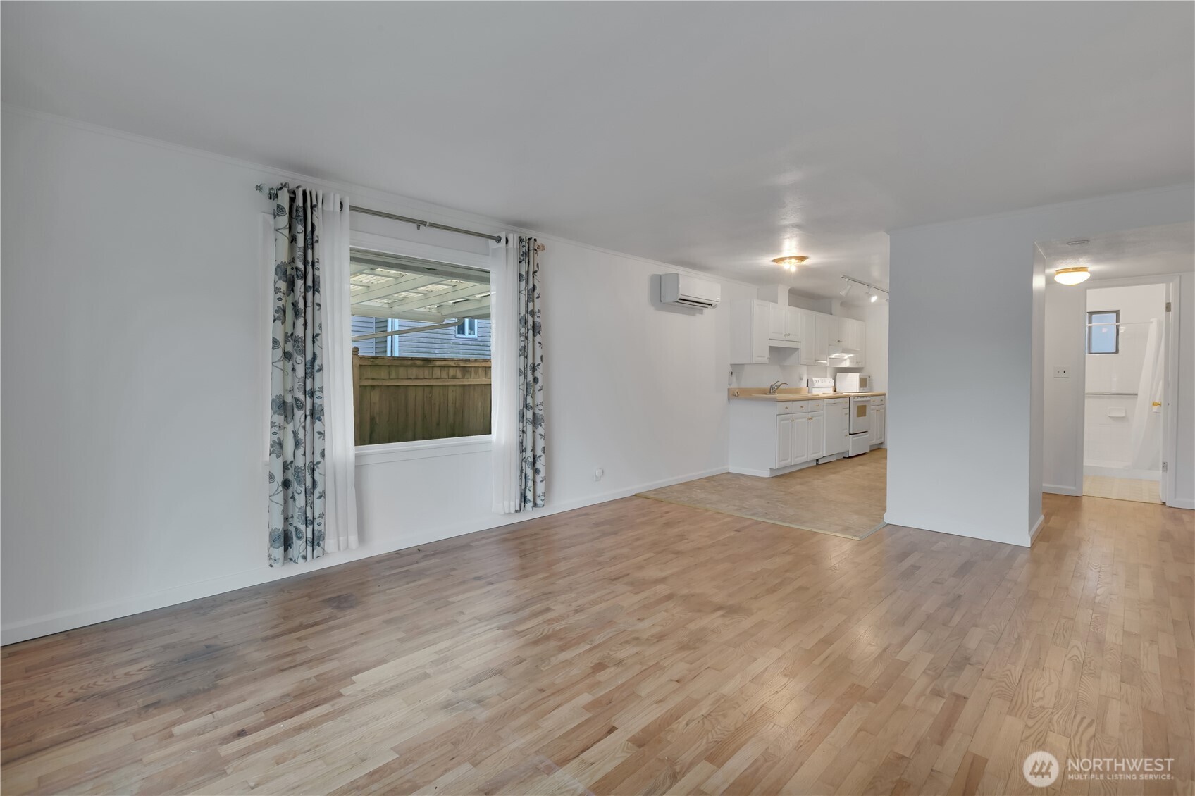 10421 2nd Place Southwest Seattle, WA 98146 - Photo 6 of 28 a view of an empty room with a window
